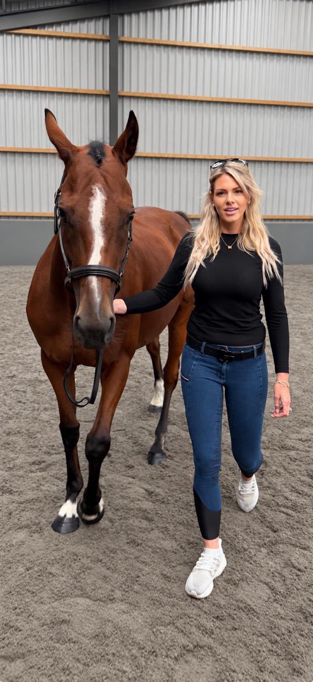 Harriet Smith walking a horse at the yard